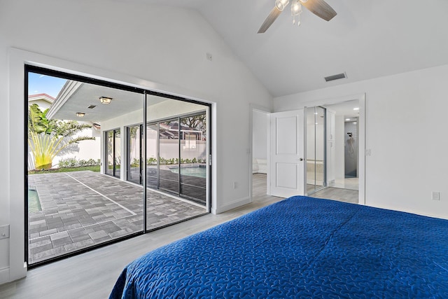 bedroom featuring access to exterior, visible vents, connected bathroom, wood finished floors, and high vaulted ceiling