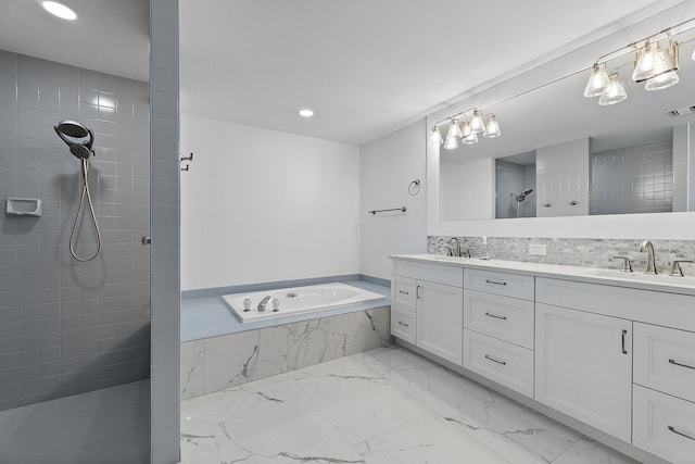 full bath featuring tiled shower, double vanity, a sink, a garden tub, and marble finish floor