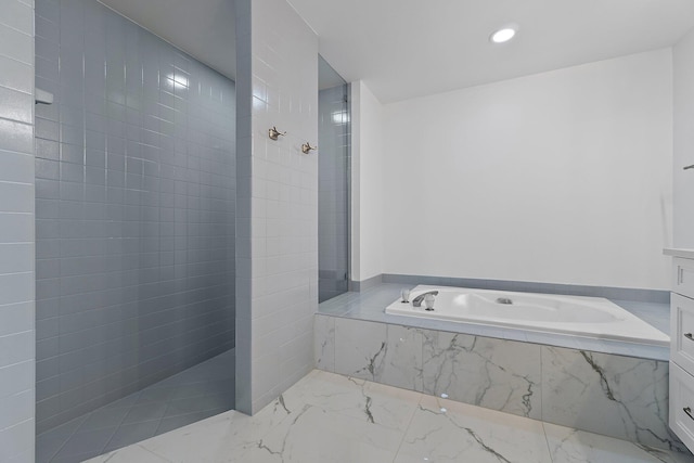 bathroom with a bath, recessed lighting, marble finish floor, and walk in shower