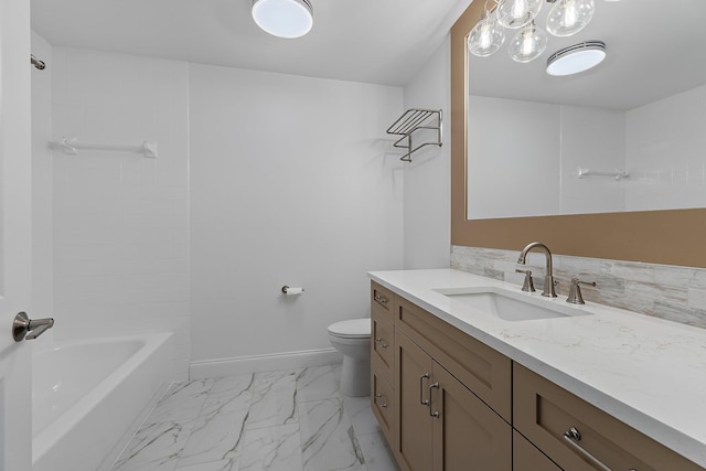 bathroom featuring toilet, marble finish floor, tasteful backsplash, baseboards, and vanity