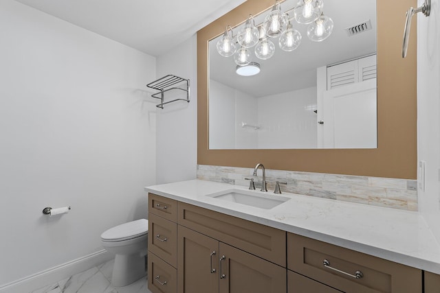 bathroom featuring visible vents, toilet, marble finish floor, baseboards, and vanity