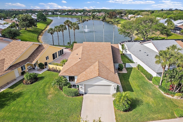 bird's eye view featuring a residential view and a water view