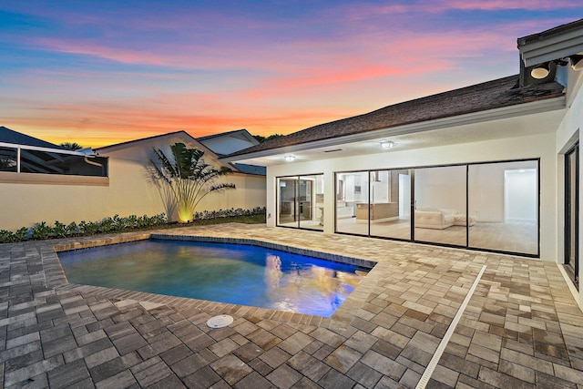 outdoor pool featuring a patio area