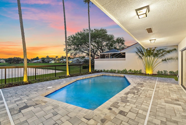 view of pool featuring a patio area, a fenced in pool, and a fenced backyard