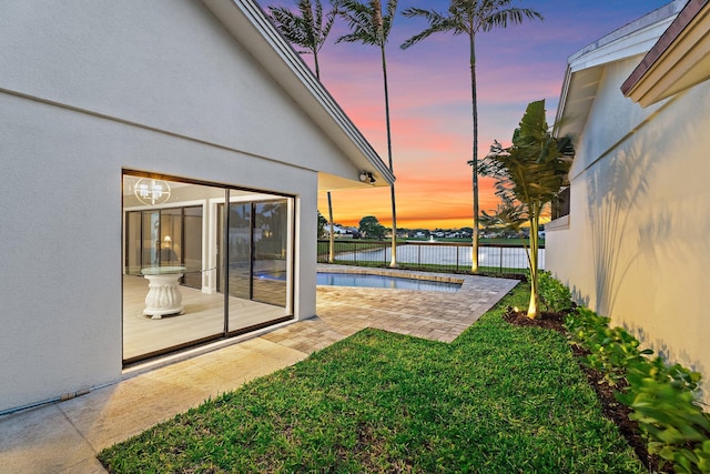 view of yard featuring a fenced in pool and a patio area