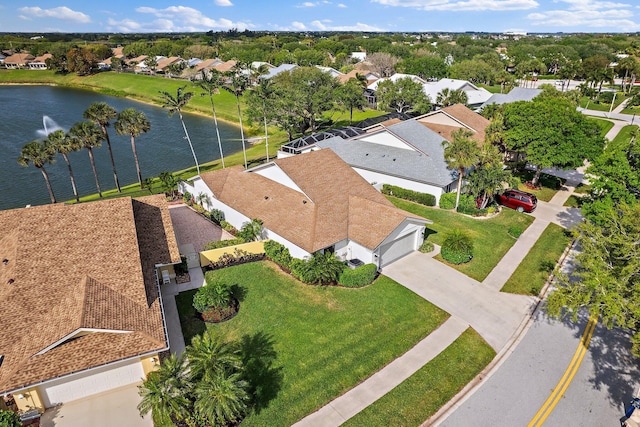 birds eye view of property with a residential view and a water view