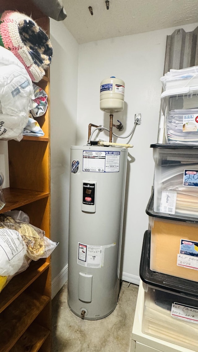 utility room with water heater