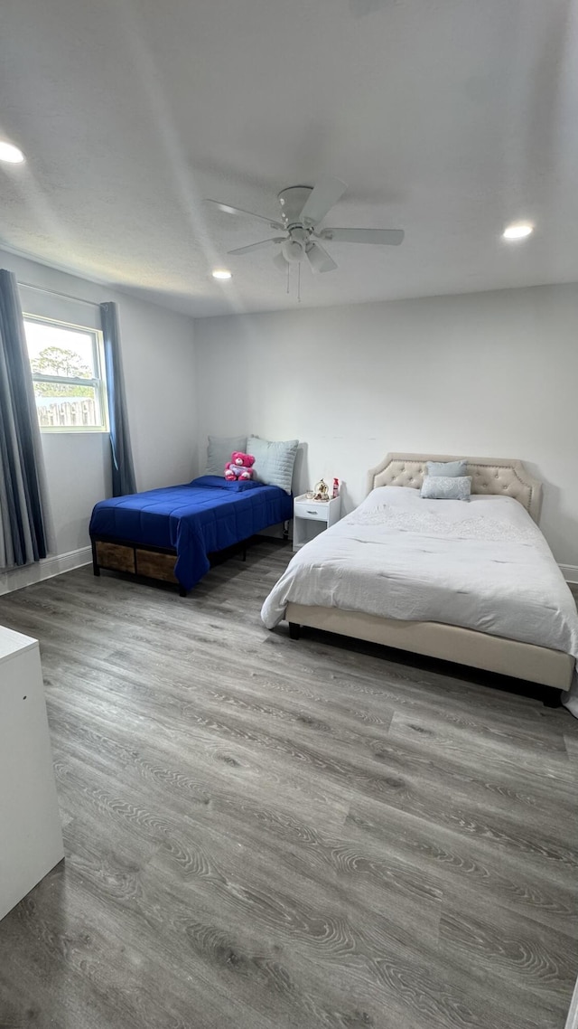 bedroom featuring recessed lighting, ceiling fan, and wood finished floors