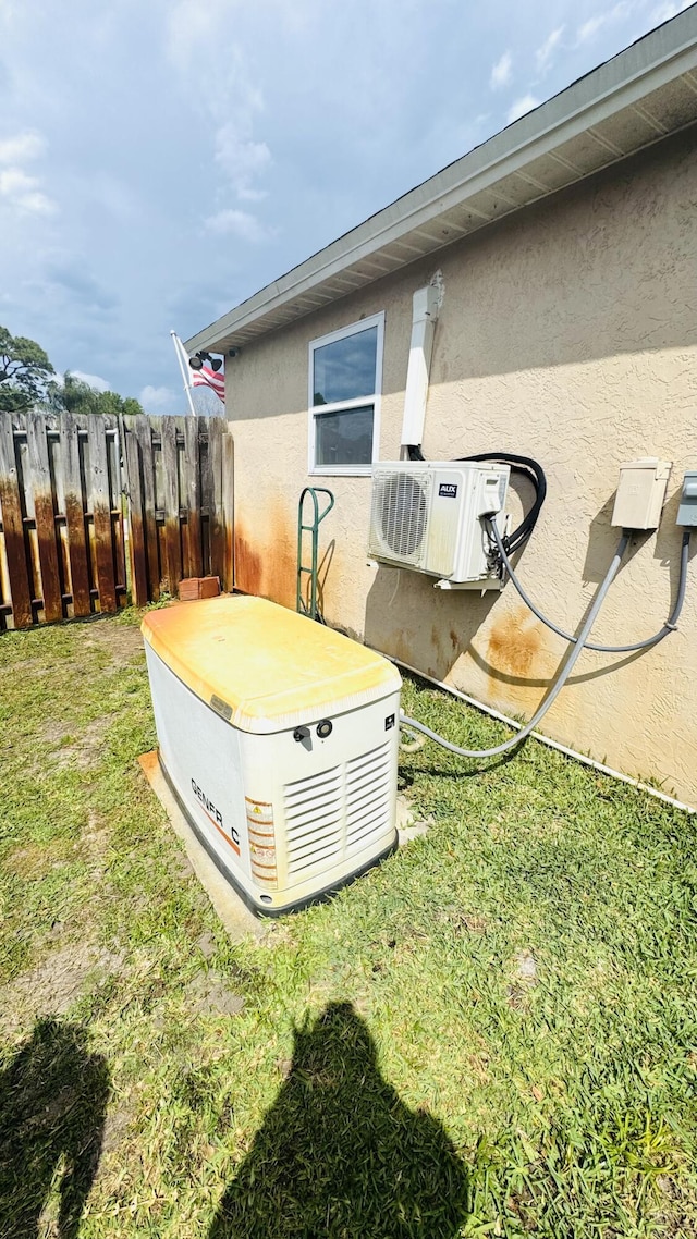 view of yard with ac unit and fence