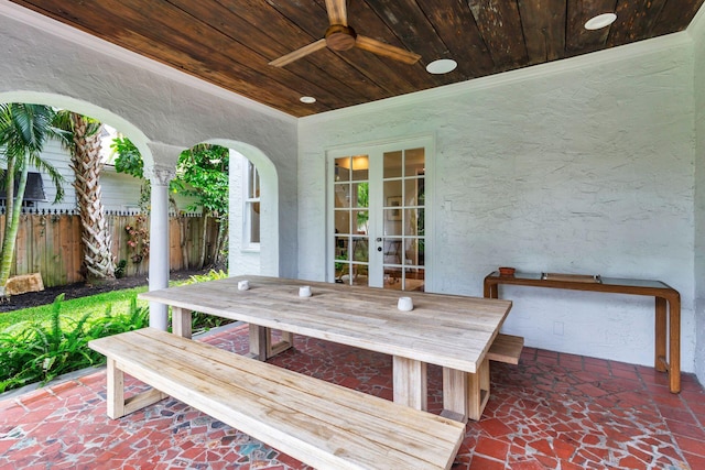 wooden terrace with french doors, a patio, ceiling fan, and fence