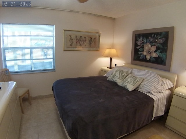 bedroom featuring light tile patterned floors