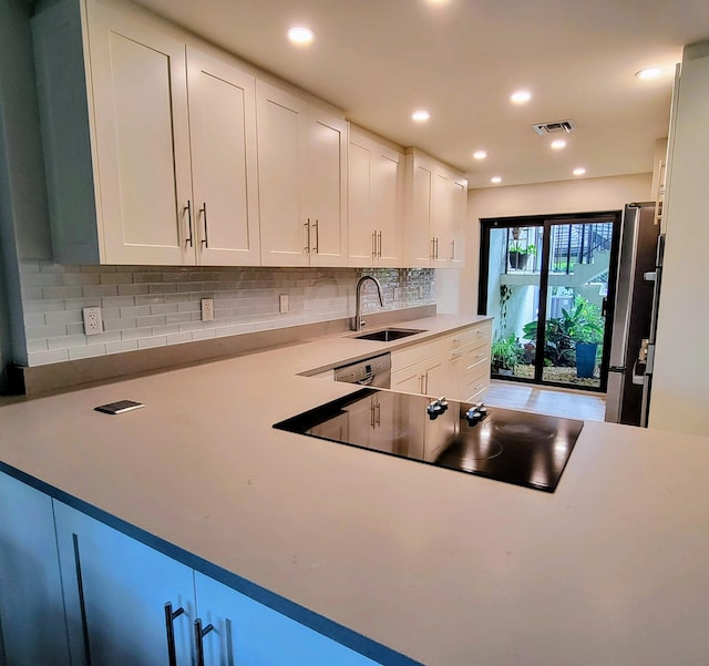 13321 Polo Club Rd Unit C103, Wellington, FL 33414 - kitchen featuring white cabinets, visible vents, appliances with stainless steel finishes, and a sink