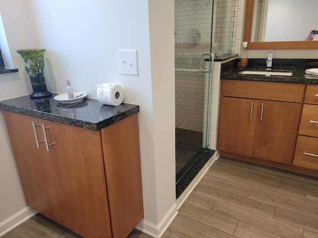 13321 Polo Club Rd Unit C103, Wellington, FL 33414 - full bath with baseboards, vanity, a shower stall, and wood tiled floor
