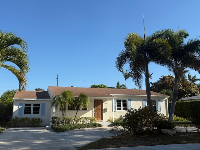 ranch-style house with stucco siding