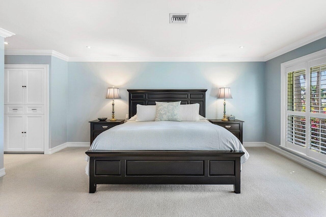 bedroom with light carpet, visible vents, baseboards, and ornamental molding