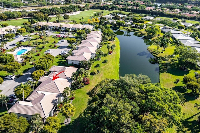 drone / aerial view featuring a residential view and a water view