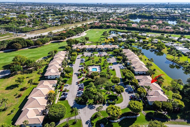 bird's eye view with a residential view, golf course view, and a water view