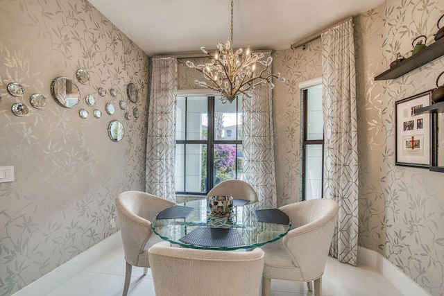 dining area featuring wallpapered walls, an inviting chandelier, baseboards, and tile patterned floors