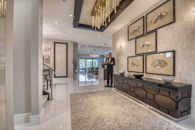 interior space with stairway, recessed lighting, and marble finish floor