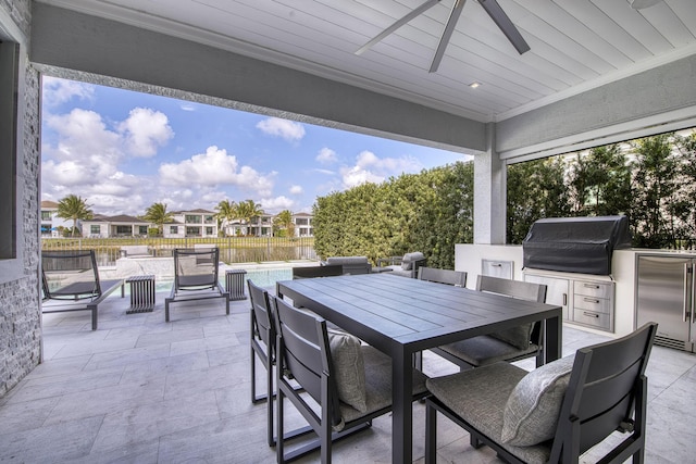 view of patio featuring a pool, area for grilling, outdoor dining space, and fence