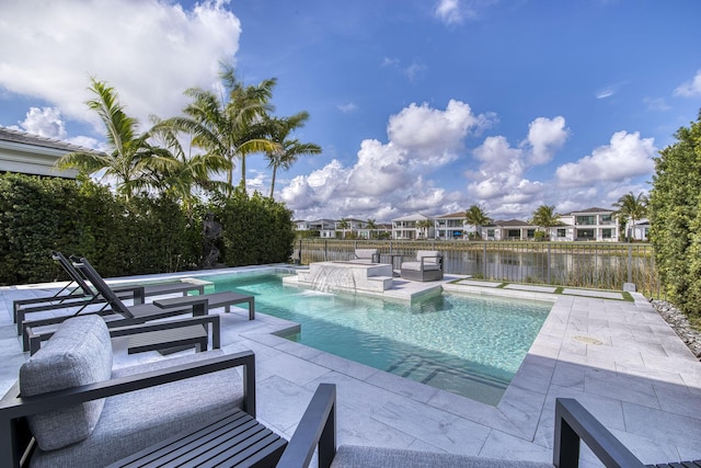 view of pool featuring a patio, fence, a fenced in pool, and a residential view