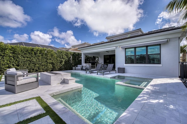 view of swimming pool featuring a patio, fence, an outdoor living space, a pool with connected hot tub, and ceiling fan