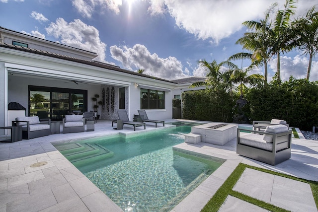 view of pool with a patio, a ceiling fan, a fenced in pool, a hot tub, and outdoor lounge area