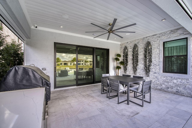 view of patio / terrace featuring outdoor dining space, ceiling fan, and area for grilling