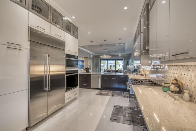 kitchen featuring light tile patterned floors, stainless steel appliances, backsplash, and modern cabinets