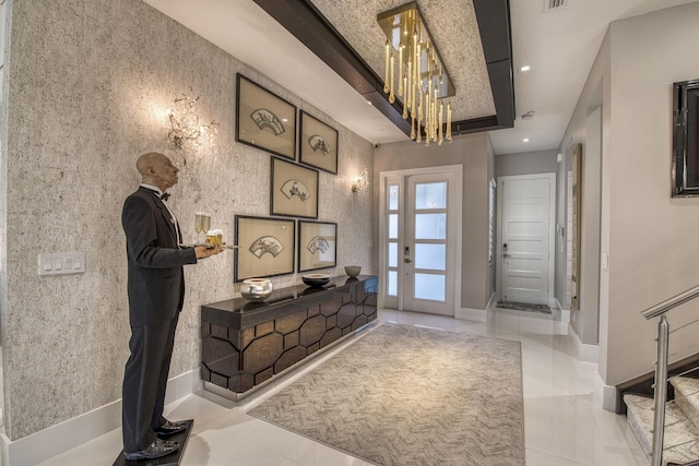 entryway featuring tile patterned floors, recessed lighting, and baseboards