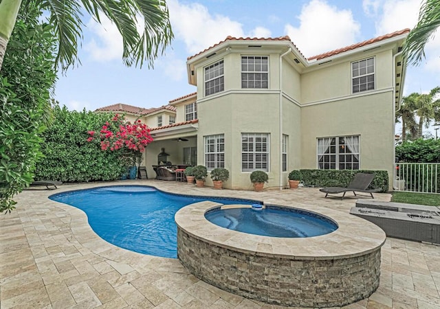 view of swimming pool featuring a fenced in pool, an in ground hot tub, a patio, and fence