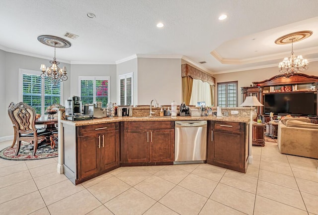 kitchen with a wealth of natural light, visible vents, dishwasher, and an inviting chandelier