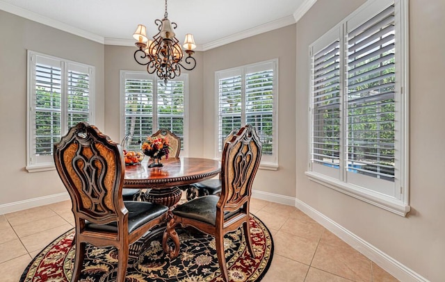 dining space featuring light tile patterned flooring, baseboards, a chandelier, and ornamental molding