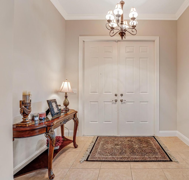 tiled entryway featuring baseboards, an inviting chandelier, and ornamental molding