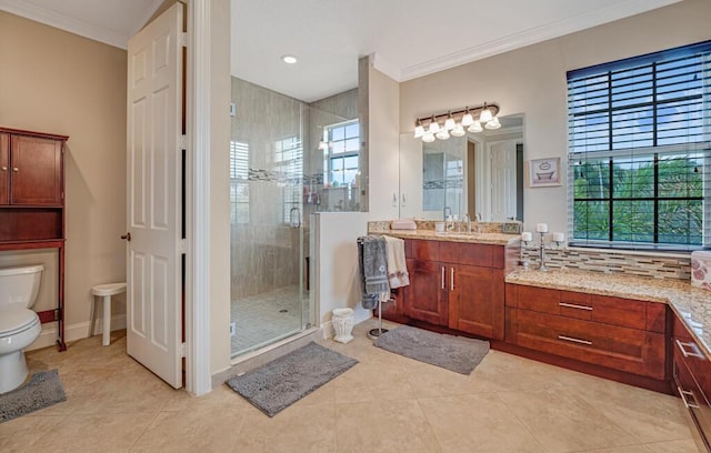 full bathroom with vanity, toilet, a stall shower, and ornamental molding