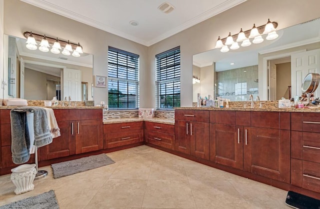 bathroom featuring tile patterned flooring, vanity, visible vents, and ornamental molding