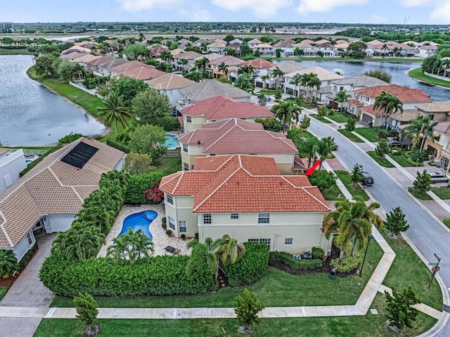 bird's eye view featuring a residential view and a water view