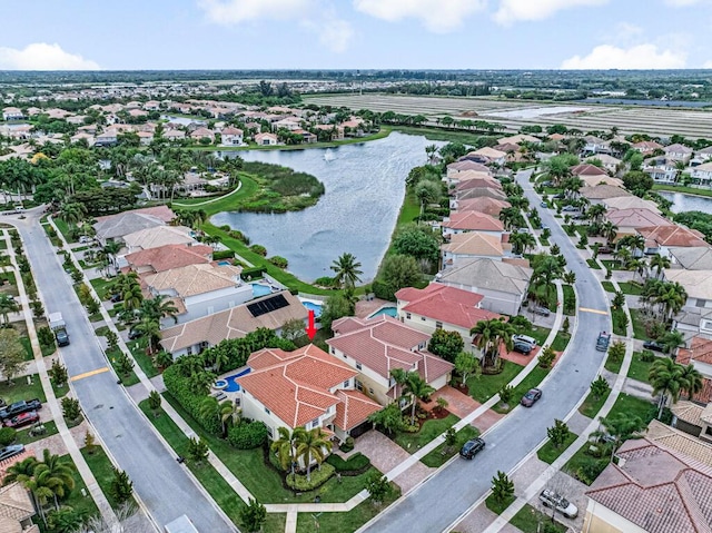 birds eye view of property featuring a residential view and a water view