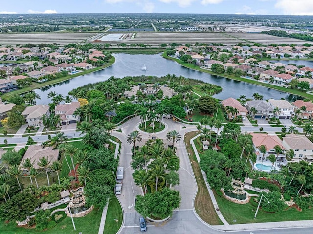 bird's eye view with a residential view and a water view