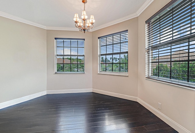 unfurnished room with baseboards, a chandelier, dark wood finished floors, and ornamental molding