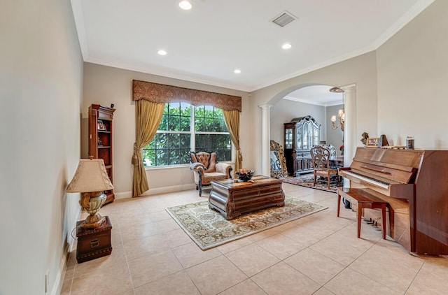 living area with visible vents, ornamental molding, arched walkways, decorative columns, and baseboards