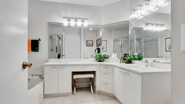 full bathroom featuring a garden tub, a shower stall, and vanity