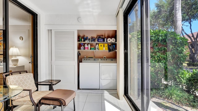 laundry room featuring washer and dryer, tile patterned flooring, and laundry area