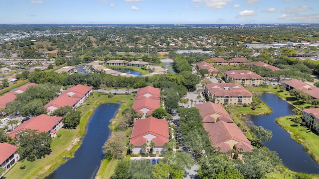 aerial view featuring a residential view and a water view