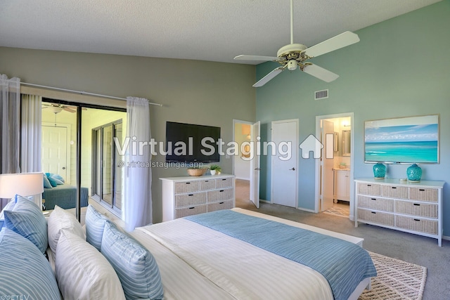 carpeted bedroom featuring visible vents, access to outside, a textured ceiling, connected bathroom, and lofted ceiling