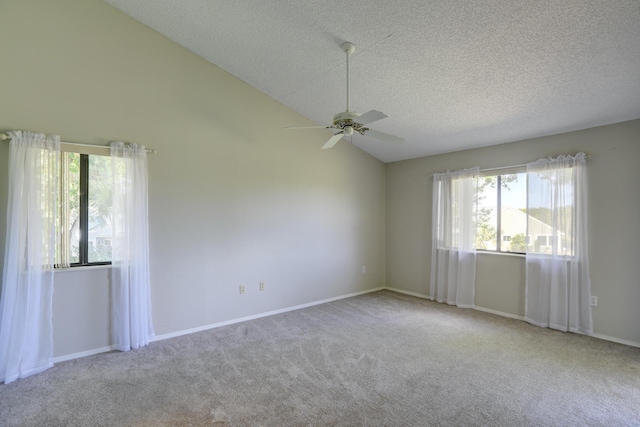 spare room with baseboards, a textured ceiling, carpet, and a ceiling fan