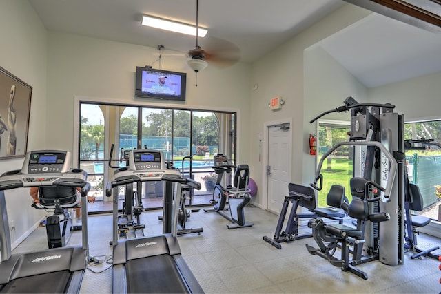 gym featuring baseboards and ceiling fan