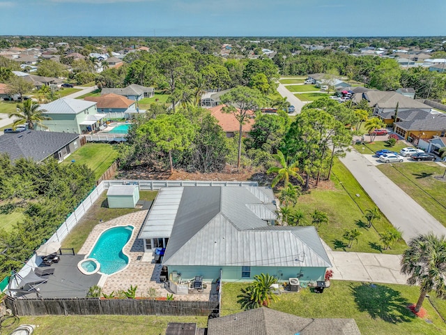 birds eye view of property with a residential view