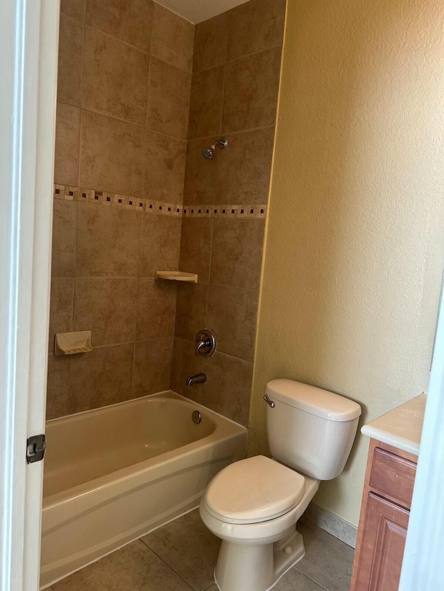 full bathroom featuring vanity, baseboards, tub / shower combination, tile patterned floors, and toilet