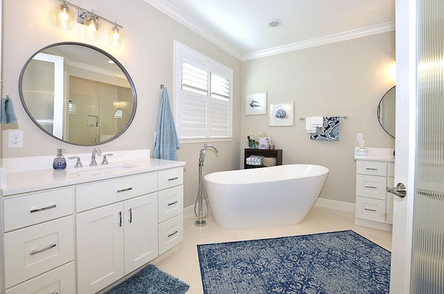 bathroom with tile patterned floors, crown molding, baseboards, a freestanding bath, and vanity